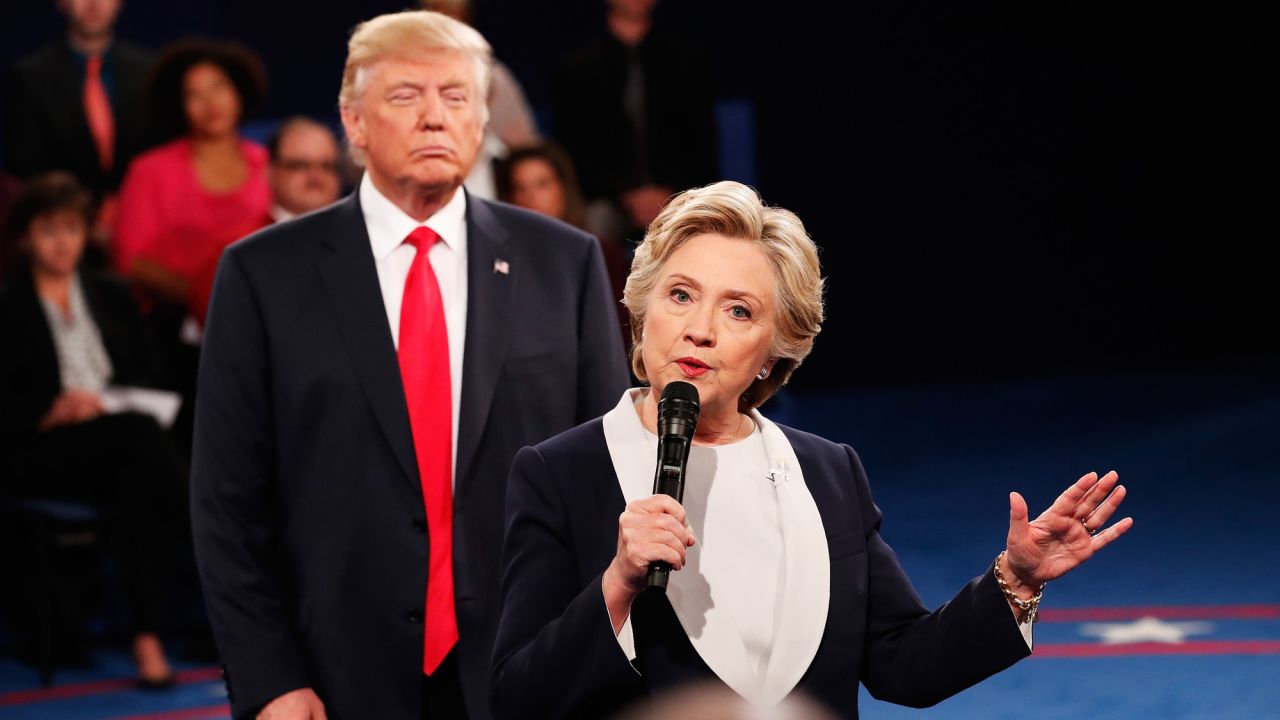 Democratic presidential nominee Hillary Clinton speaks as Donald Trump, the Republican nominee, looks on during the <a href="http://www.cnn.com/2016/10/10/opinions/clinton-trump-second-debate-roundup/index.html" target="_blank">second presidential debate</a> in St. Louis, Missouri, on Sunday, October 9. Trump and Clinton clashed on a <a href="http://www.cnn.com/2016/10/09/politics/debate-fact-check-trump-clinton/" target="_blank">range of issues</a>.