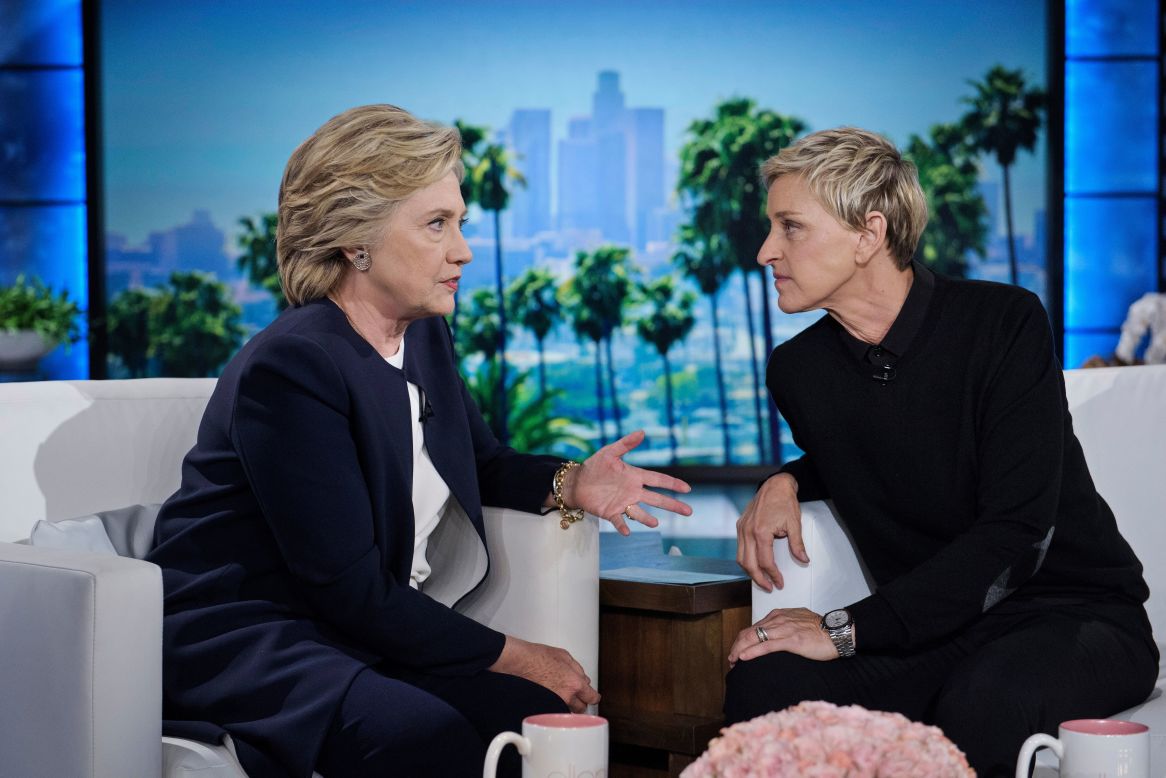 Democratic presidential nominee Hillary Clinton, left, talks with television host Ellen DeGeneres during a commercial break on "The Ellen DeGeneres Show" in Burbank, California, on Thursday, October 13.