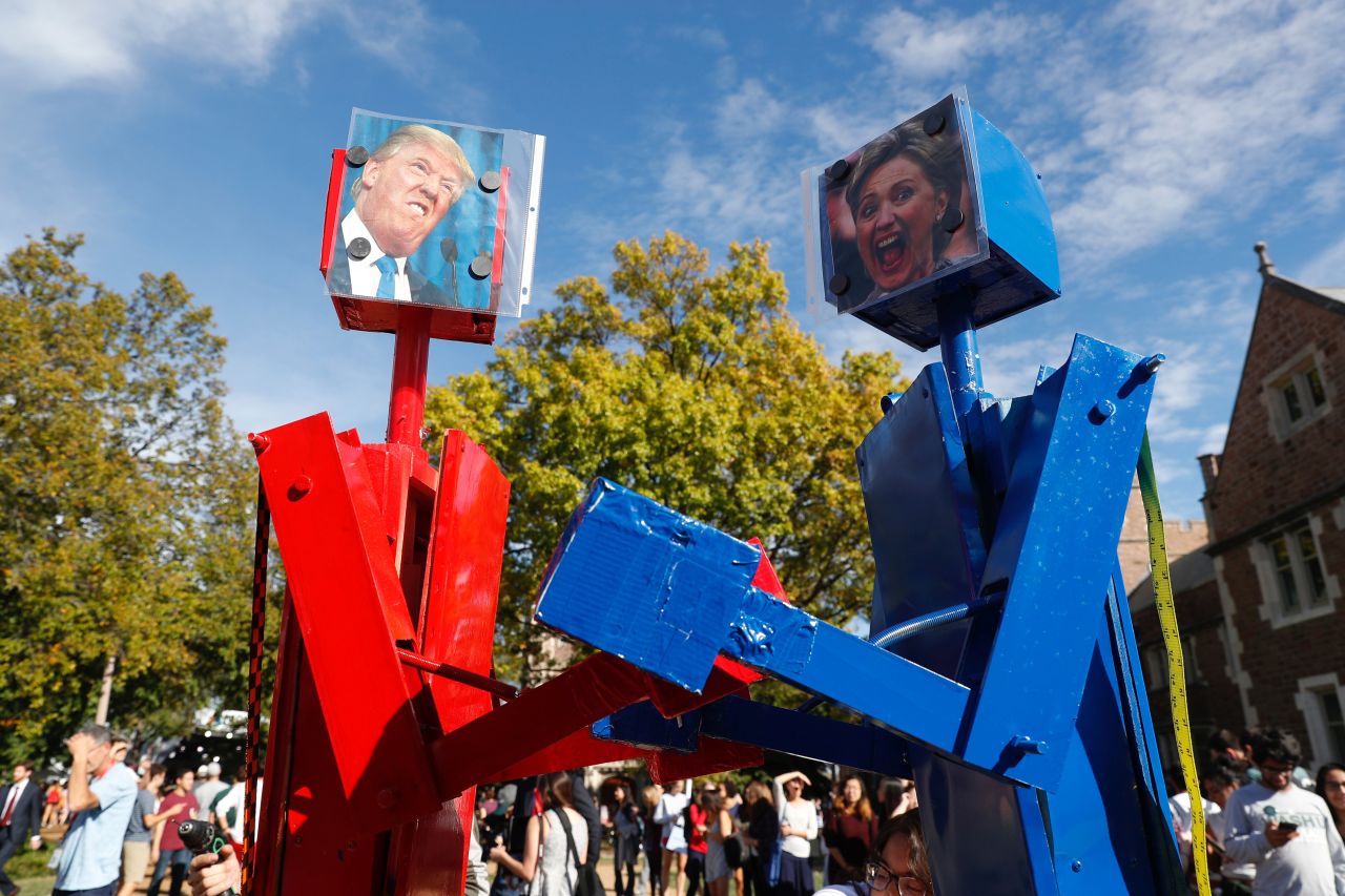 Robots with portraits of presidential nominees Donald Trump and Hillary Clinton are seen before the second presidential debate in St. Louis, Missouri, on Sunday, October 9.