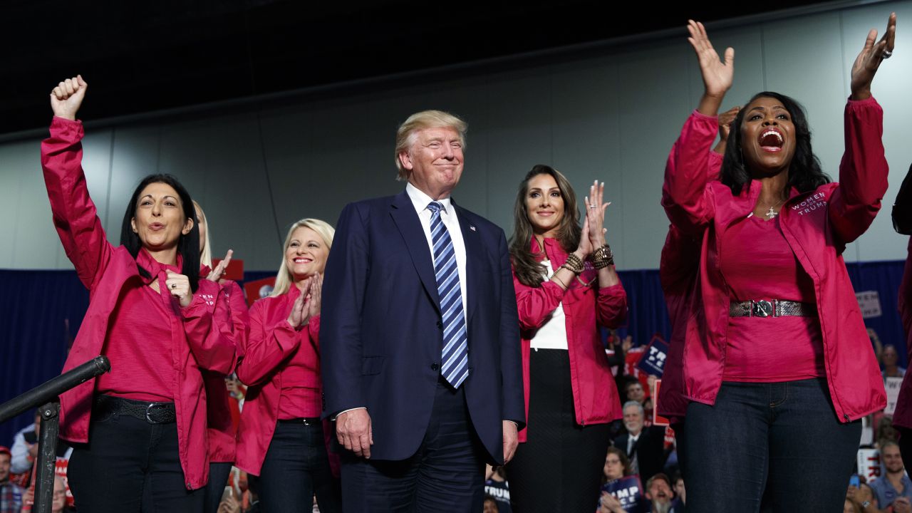 Republican presidential candidate Donald Trump stands on stage with female supporters during a campaign rally Friday, October 14, in Charlotte, North Carolina. 