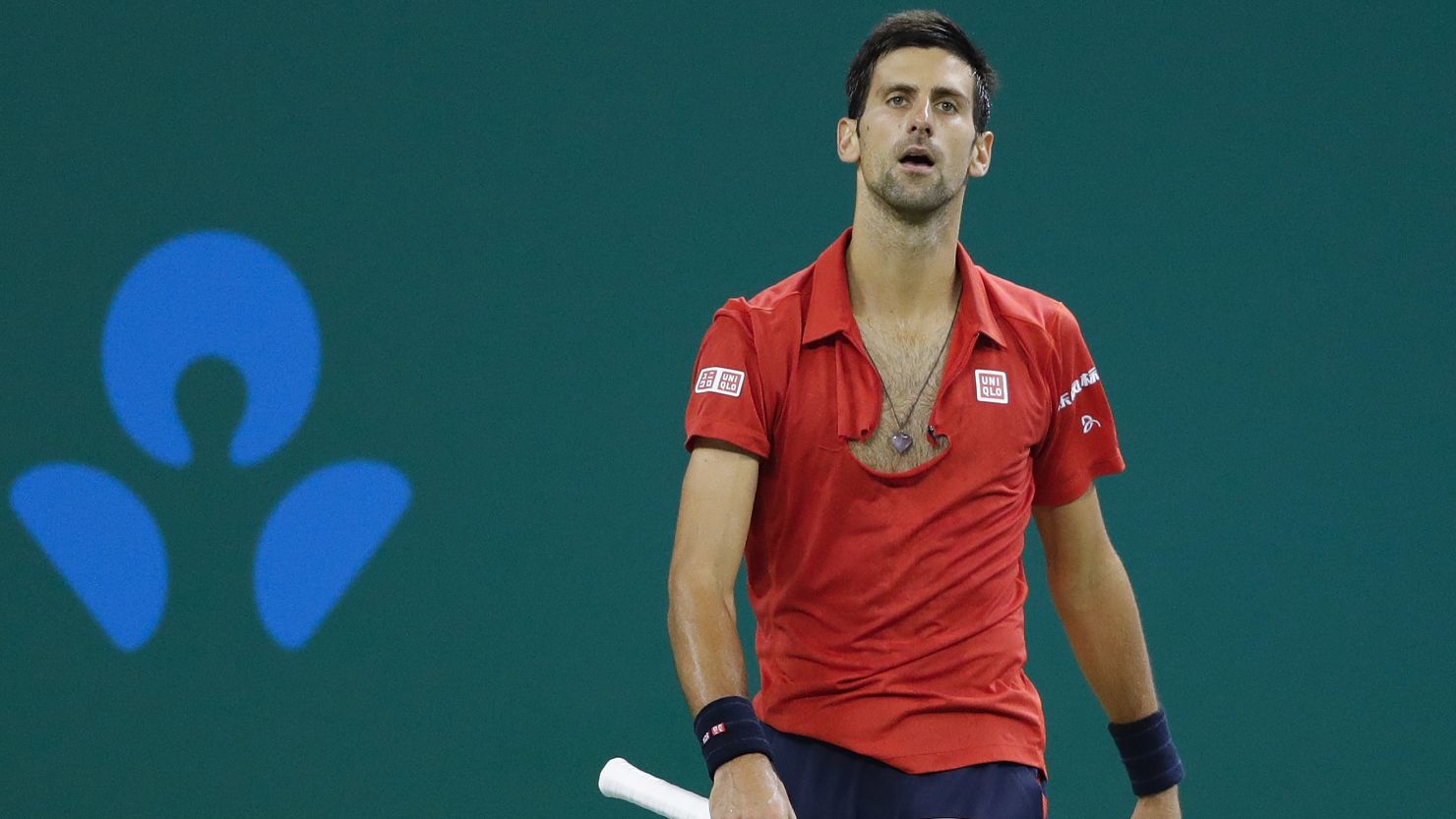 Novak Djokovic tore his shirt in anger after losing a point in his semifinal defeat to Roberto Bautista Agut.