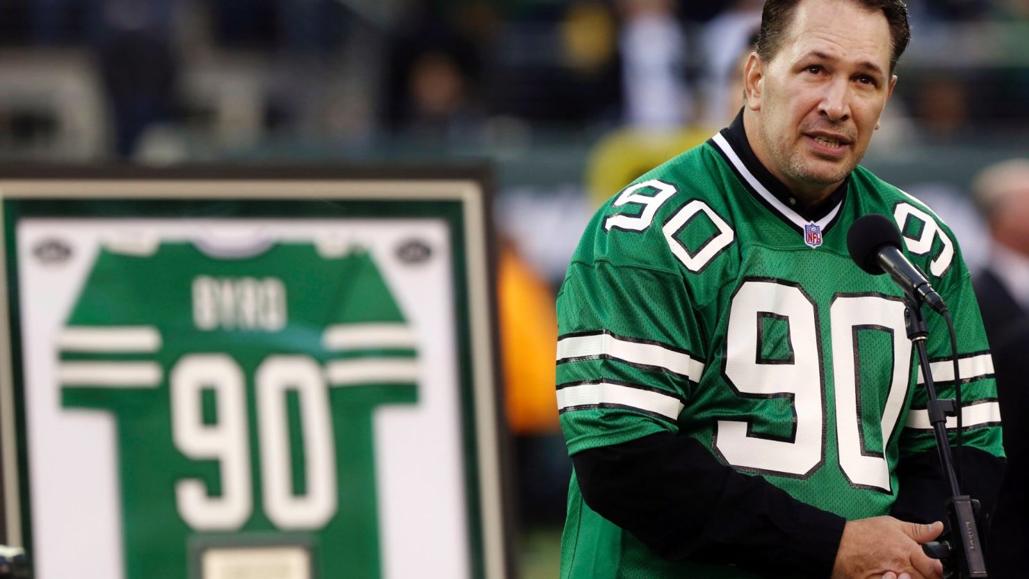 Dennis Byrd speaks during a 2012 ceremony to retire his New York Jets jersey.