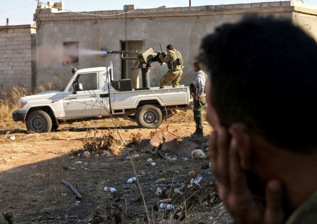 Rebels from the Free Syrian Army fire against ISIS on the outskirts of Dabiq on Saturday, one day before they seized the city from the terror group.