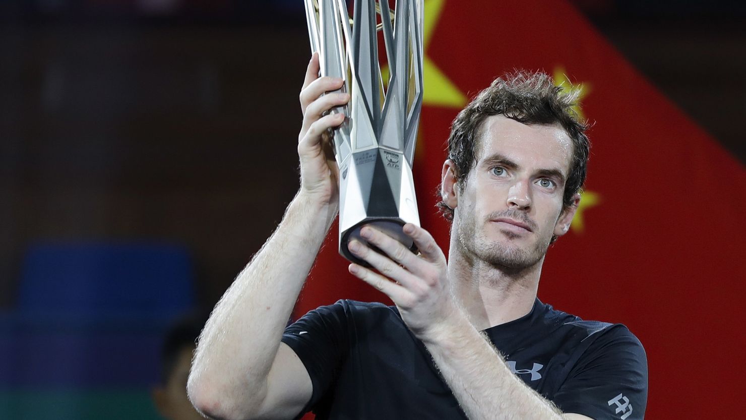Andy Murray poses with trophy after beating Roberto Bautista Agut of Spain in the final of the Shanghai Masters.