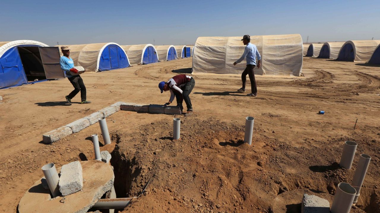 Workers build shelters to house civilians expected to flee the violence.