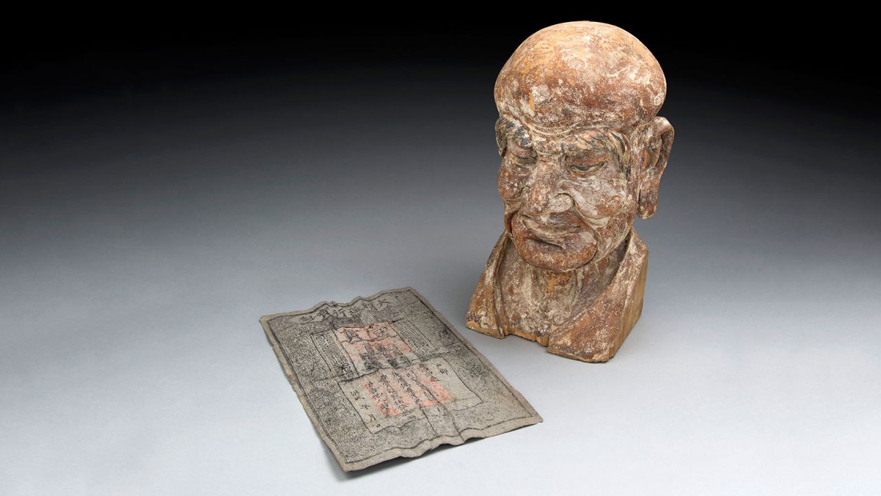 Specialists at Mossgreen auctions in Australia discovered this Ming dynasty banknote hidden inside the head of this 14th century Buddhist carving. The wooden sculpture represents the head of a Luohan -- an enlightened person who has reached Nirvana in Buddhist culture. 