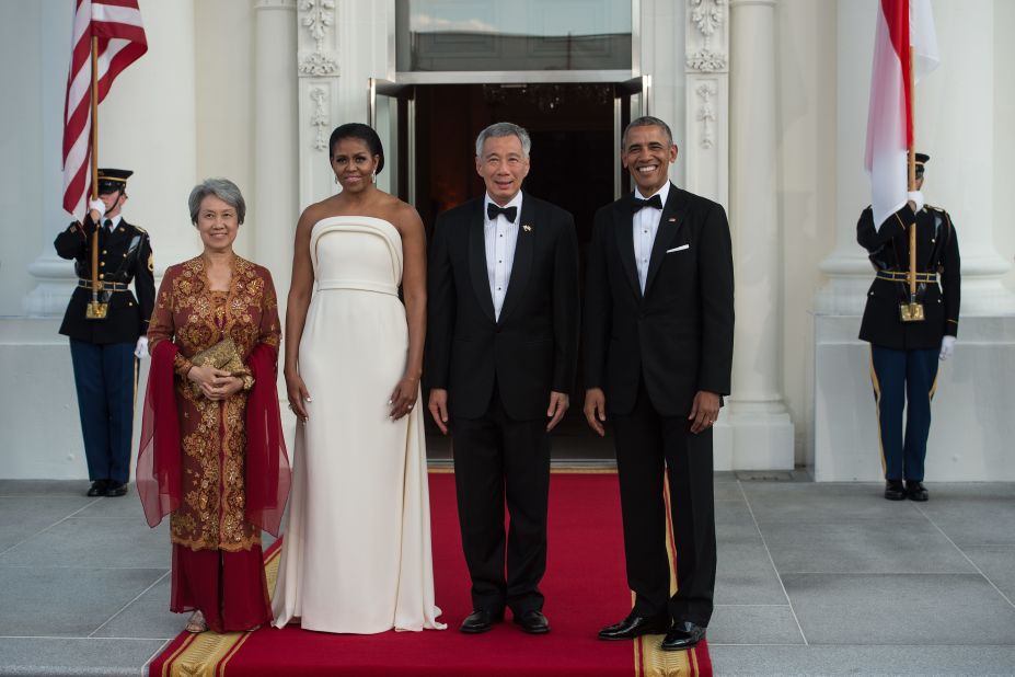 President Barack Obama and first lady Michelle Obama greet Singapore's Prime Minister Lee Hsien Loong and his wife, Ho Ching, for a state dinner at the White House on August 2, 2016. 
