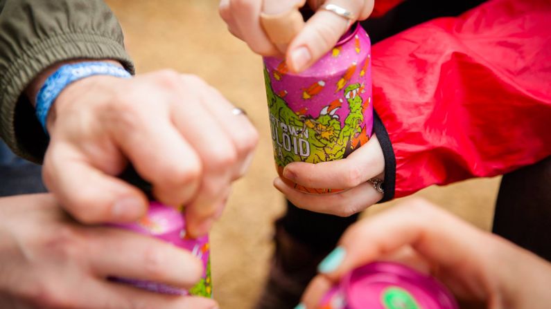 "The UK have contributed more to the world brewing scene really than any other country," says beer writer Melissa Cole. Pictured: Visitors to north London's Beavertown Brewery crack open cans of Lupuloid IPA. 