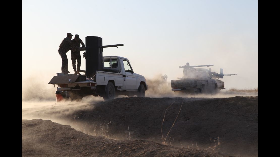 Kurdish Peshmerga forces begin to clear villages on the outskirts of Mosul on October 16, 2016. 