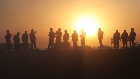 Kurdish Peshmerga infantry forces watch as tanks and APCs cross into ISIS-held territory as the mission to liberate Mosul gets underway.