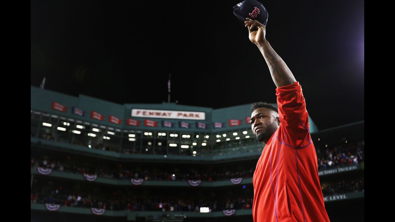 Retiring baseball star David Ortiz tips his cap to the home fans in Boston after playing his final game on Monday, October 10. Ortiz and the Red Sox were swept by Cleveland in the American League playoffs.