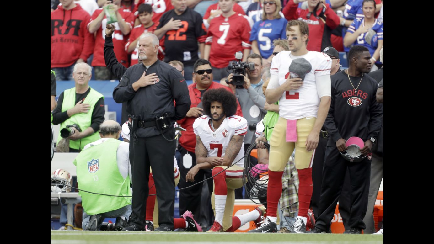San Francisco quarterback Colin Kaepernick kneels during the national anthem before an NFL game at Buffalo on Sunday, October 16. Kaepernick was <a href="http://www.cnn.com/2016/10/15/sport/colin-kaepernick-starts-anthem-protest/" target="_blank">starting his first game for the 49ers</a> since his protest began in August.