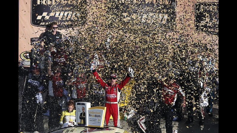 NASCAR driver Kevin Harvick celebrates after winning the Sprint Cup race at Kansas Speedway on Sunday, October 16.