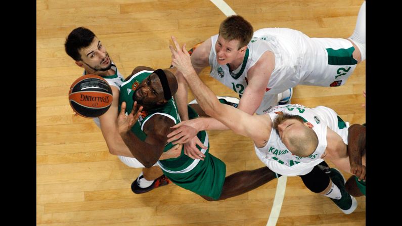 Panathinaikos forward Chris Singleton is surrounded by Zalgiris defenders during a EuroLeague game in Athens, Greece, on Friday, October 14.