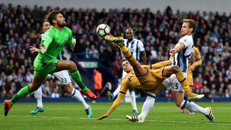 Tottenham's Dele Alli tries to shoot past West Brom goalkeeper Ben Foster during a Premier League match in West Bromwich, England, on Saturday, October 15. 