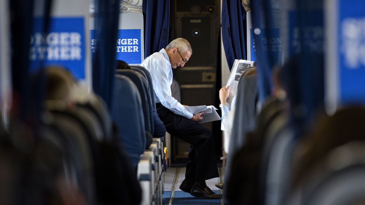 John Podesta, Clinton Campaign Chairman, reads over notes on board Clinton's plane at Westchester County Airport on September 27, 2016 in White Plains, New York.