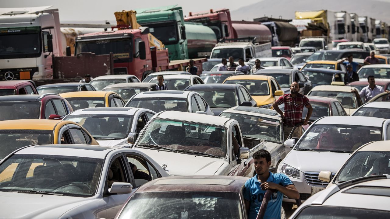 Traffic from Mosul queues at a Kurdish check point on June 14, 2014 in Kalak, Iraq.