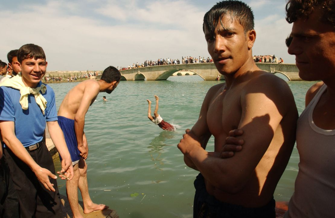 Boys enjoy a swim in 2003, when Mosul residents were free from ISIS rule.