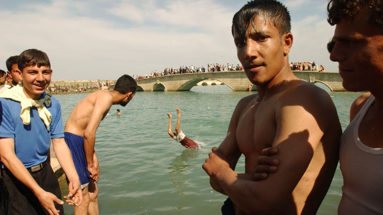 Boys enjoy a swim in 2003, when Mosul residents were free from ISIS rule.