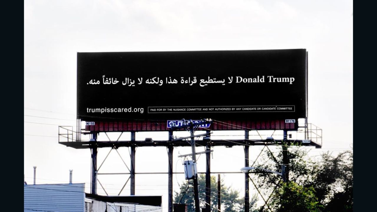 A billboard in Dearborn, Michigan reads "Donald Trump can't read this, but he's afraid of it anyway" in Arabic.