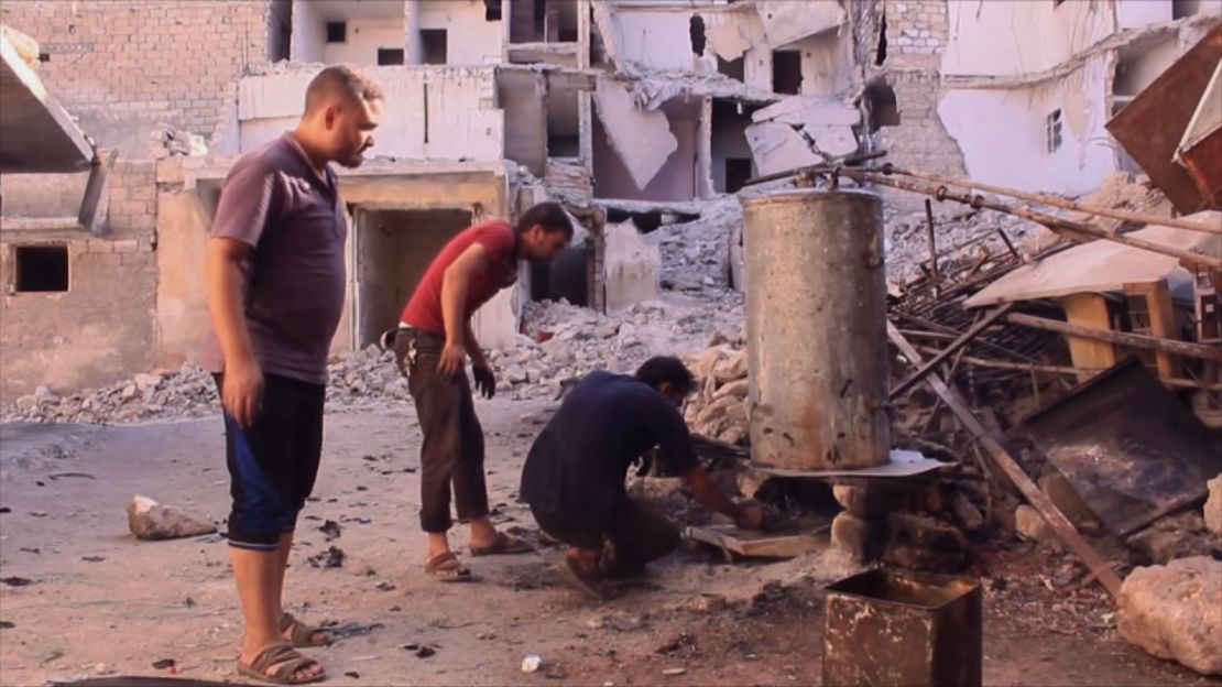 Aleppo residents use an old boiler to make fuel out of plastic.