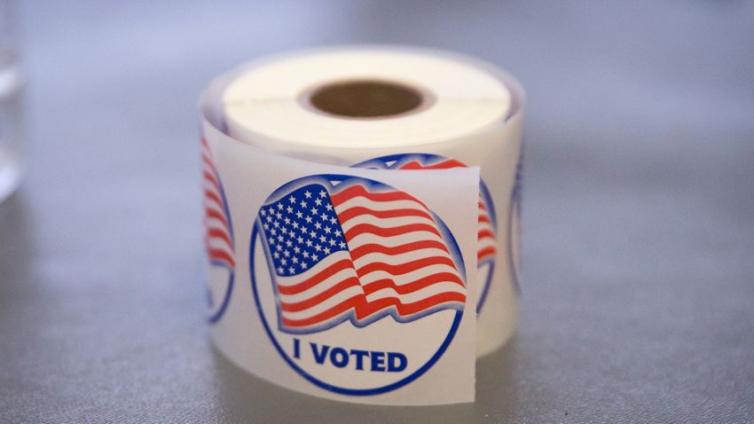 A roll of "I Voted" stickers, which are handed out to residents after they vote, sit on an election officials table at a polling place on November 4, 2014 in Ferguson, Missouri.  In last Aprils election only 1,484 of Ferguson's 12,096 registered voters cast ballots. Community leaders are hoping for a much higher turnout for this election. Following riots sparked by the August 9 shooting death of Michael Brown by Darren Wilson, a Ferguson police officer, residents of this majority black community on the outskirts of St. Louis have been forced to re-examine race relations in the region and take a more active role in the region's politics. Two-thirds of Fergusons population is African American yet five of its six city council members are white, as is its mayor, six of seven school board members and 50 of its 53 police officers.  (Photo by Scott Olson/Getty Images)