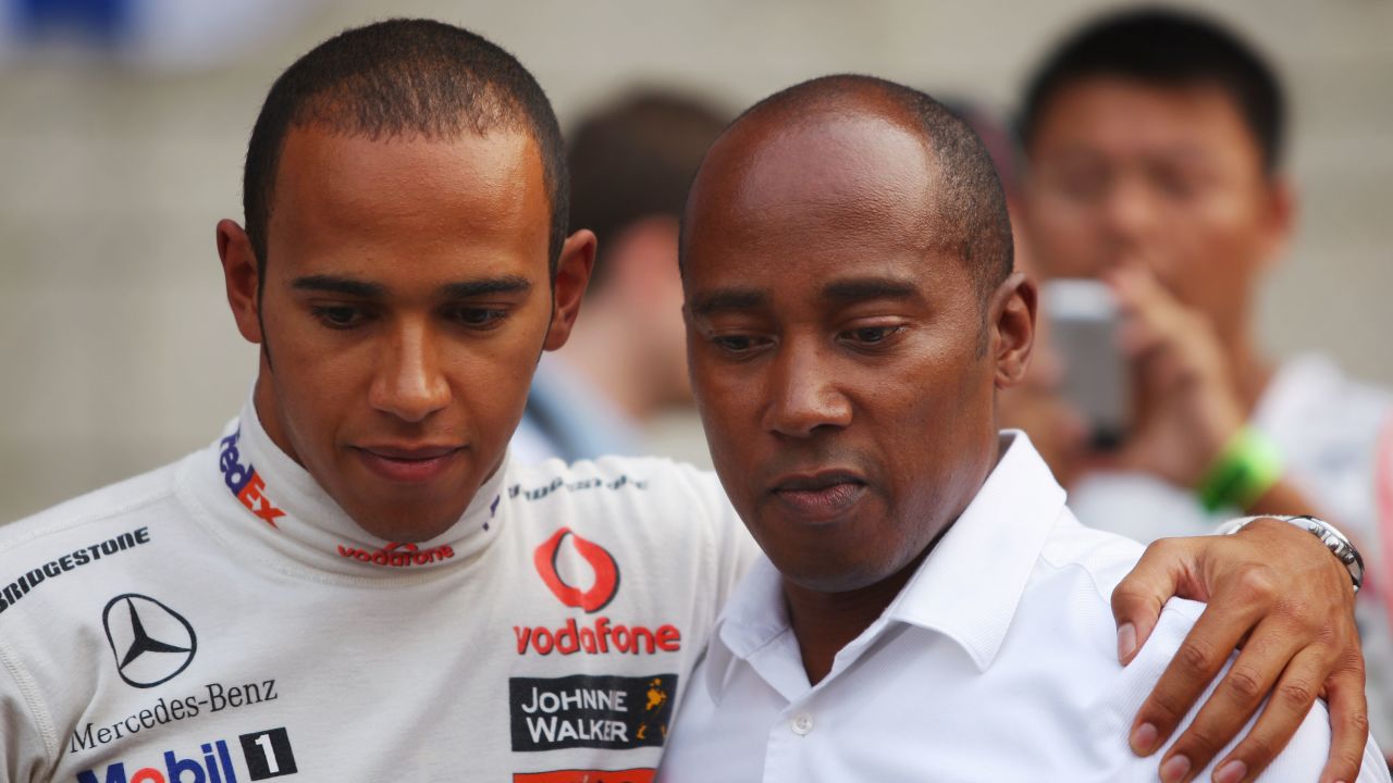 SHANGHAI, CHINA - OCTOBER 19:  Lewis Hamilton (L) of Great Britain and McLaren Mercedes is seen with his father Anthony Hamilton on the grid before the start of the Chinese Formula One Grand Prix at the Shanghai International Circuit on October 19, 2008 in Shanghai, China.  (Photo by Mark Thompson/Getty Images)