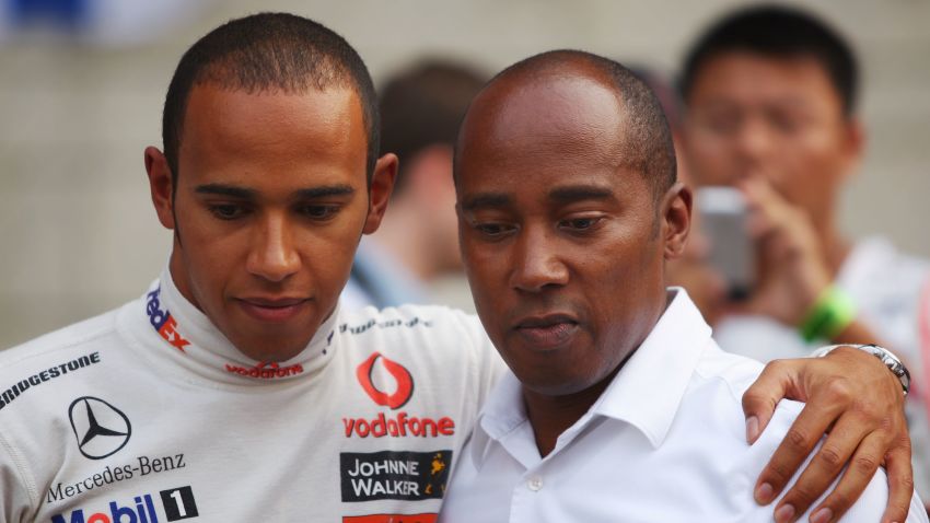 SHANGHAI, CHINA - OCTOBER 19:  Lewis Hamilton (L) of Great Britain and McLaren Mercedes is seen with his father Anthony Hamilton on the grid before the start of the Chinese Formula One Grand Prix at the Shanghai International Circuit on October 19, 2008 in Shanghai, China.  (Photo by Mark Thompson/Getty Images)
