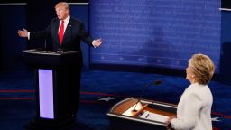 Republican presidential nominee Donald Trump (L) speaks as Democratic presidential nominee former Secretary of State Hillary Clinton looks on during the third U.S. presidential debate at the Thomas & Mack Center on October 19, 2016 in Las Vegas, Nevada.