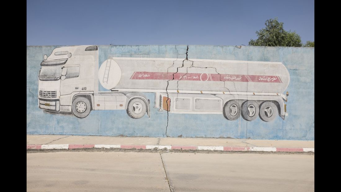 A gas truck is painted on the wall of one station.