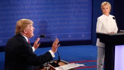 TOPSHOT - Republican nominee Donald Trump gestures as Democratic nominee Hillary Clinton looks on during the final presidential debate at the Thomas & Mack Center on the campus of the University of Las Vegas in Las Vegas, Nevada on October 19, 2016. / AFP / Mark RALSTON (Photo credit should read MARK RALSTON/AFP/Getty Images)