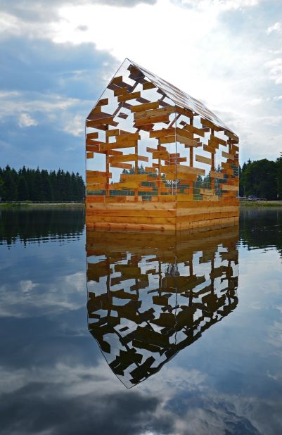 Walden's raft is a hybrid between a raft and a cabin. This mobile vessel is designed to look like a deconstructed version of a pitched roof cabin. 