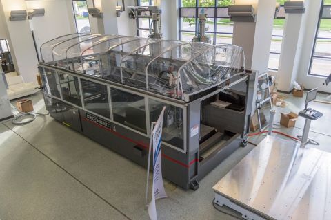 Olli can be produced in two weeks through this 3-D printer. Using printed materials allows Local Motors to scale up production rapidly, and use a lower-carbon production process. 