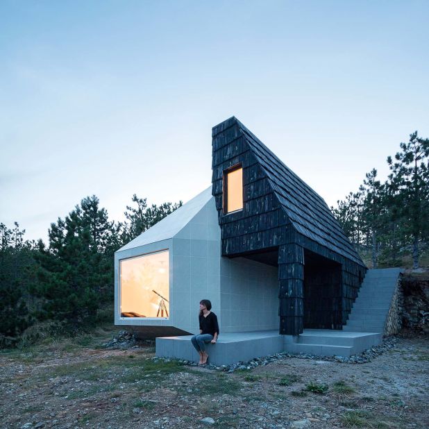 This cabin is a remodeled Serbian chalet, which has been adapted to include contemporary design elements. The base, walls, and roof of the original building are turned to its side, and then reworked to include a solar panel and a natural thermal wheel to make the structure ecologically friendly.
