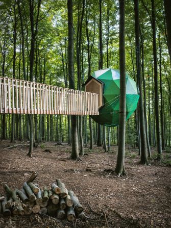 Architect Peter Becker created this tree-house structure during a six-month hiatus from his city life. The collection of small tree houses is held together by a series of hanging walkways. 