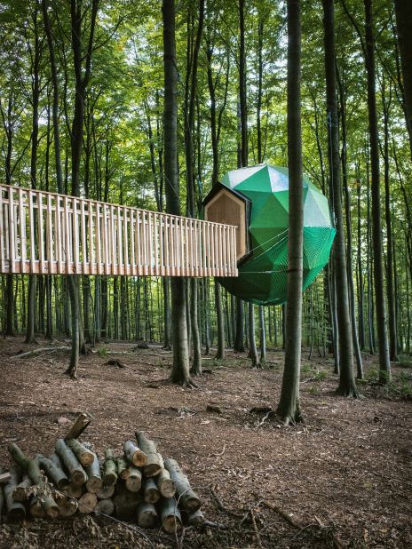 Architect Peter Becker created this tree-house structure during a six-month hiatus from his city life. The collection of small tree houses is held together by a series of hanging walkways. 