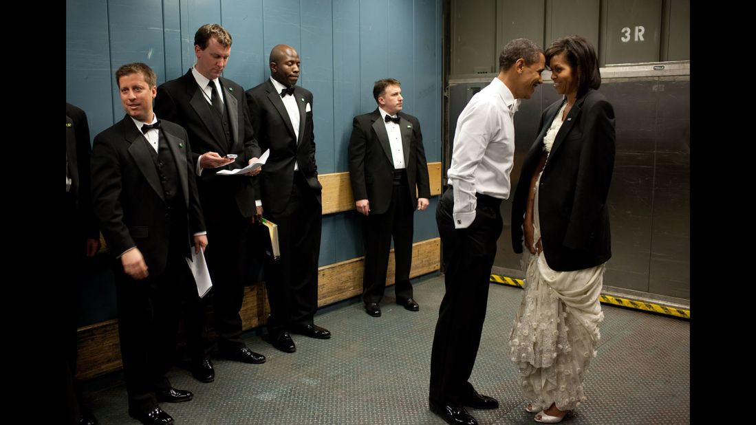 The Obamas share a moment on a freight elevator as they head to one of the inaugural balls on January 20, 2009. "It was quite chilly, so the President removed his tuxedo jacket and put it over the shoulders of his wife," White House photographer Pete Souza said. "Then they had a semi-private moment as staff members and Secret Service agents tried not to look."