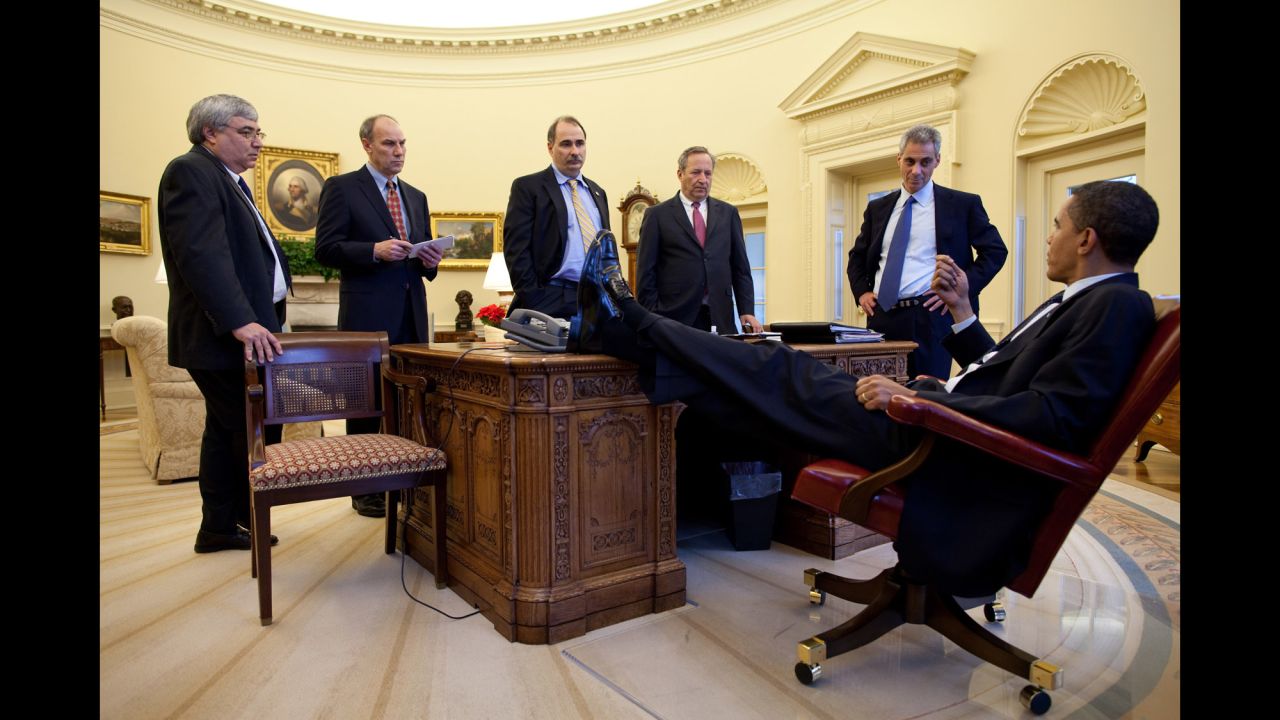 Obama speaks with aides in the White House Oval Office on February 4, 2009. From left are Senior Advisor Pete Rouse, White House Director of Legislative Affairs Phil Schiliro, Senior Advisor David Axelrod, National Economic Council Director Lawrence Summers and White House Chief of Staff Rahm Emanuel.
