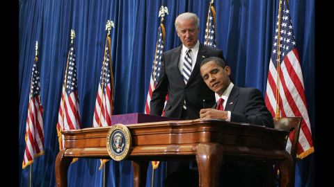 Vice President Joe Biden watches Obama sign <a href="http://www.cnn.com/2010/POLITICS/02/17/economic.stimulus.2010/" target="_blank">the economic stimulus bill</a> on February 17, 2009. The goal was to stimulate the country's staggering economy by increasing federal spending and cutting taxes.