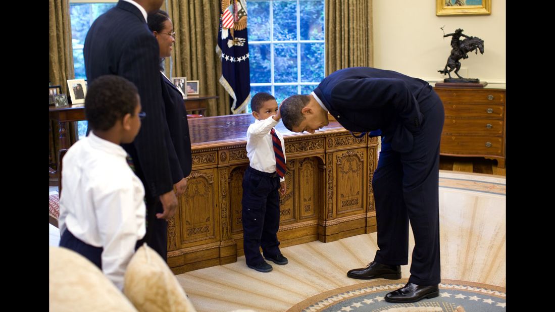 A boy touches Obama's hair in the Oval Office on May 8, 2009. "A temporary White House staffer, Carlton Philadelphia, brought his family to the Oval Office for a farewell photo with President Obama," White House photographer Pete Souza said. "Carlton's son softly told the President he had just gotten a haircut like President Obama, and asked if he could feel the President's head to see if it felt the same as his."