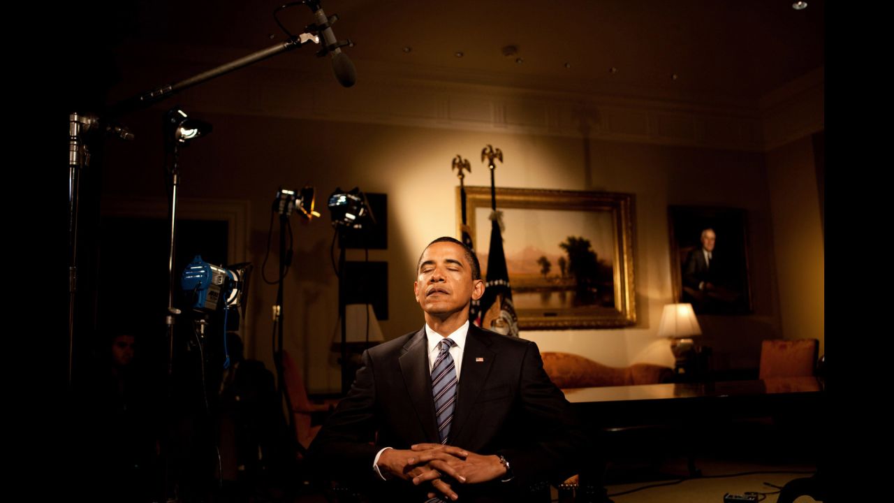Obama closes his eyes before taping his weekly radio address at the White House on June 2, 2009.