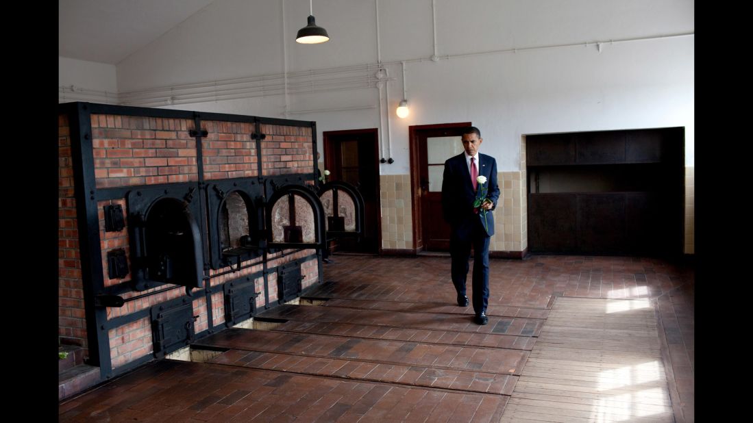 Obama places a flower at the Buchenwald Memorial as he visits the former concentration camp in Germany on June 5, 2009.