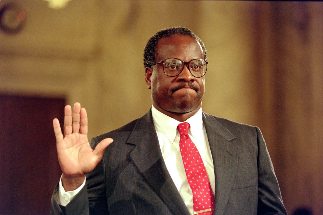US Supreme Court nominee Clarence Thomas raises his right hand as he is sworn in on Sept. 10, 1991, during confirmation hearings before the US Senate Judiciary Committee, in Washington, DC.