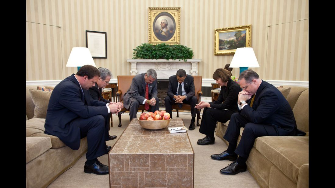 Obama prays in the Oval Office with co-chairs of the National Prayer Breakfast on January 27, 2011. From left are U.S. Rep. Heath Shuler, U.S. Rep. Tom Coburn, U.S. Rep. Jeff Miller, Obama, former Arizona Rep. Ann Kirkpatrick and U.S. Sen. Mark Pryor.