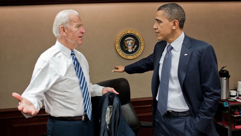 Obama talks with Vice President Joe Biden after a teleconference call about Libya on April 5, 2011. Obama <a href="index.php?page=&url=http%3A%2F%2Fwww.cnn.com%2F2011%2FPOLITICS%2F03%2F28%2Fus.libya%2F" target="_blank">committed U.S. forces</a> to the U.N.-authorized mission in Libya, and he told the American people there were strategic and moral reasons to act. Failure to do so, he said, would have allowed Libyan leader Moammar Gadhafi to unleash his military on his own people.