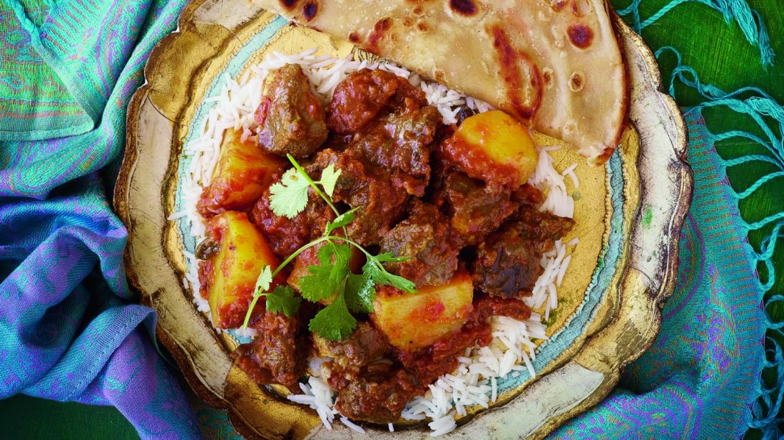 Packed with cinnamon, cardamom and roasted masala, this curry has big chunks of marinated mutton and potatoes and comes topped with fresh cilantro.