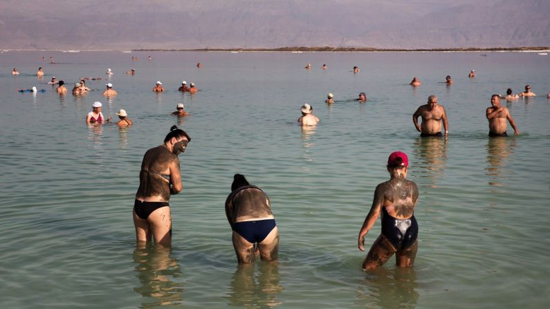 Tourists cover themselves with Dead Sea mud at a resort in Neve Zohar, Israel, on Saturday, October 15. The mud is rich in minerals and said to be good for the skin.
