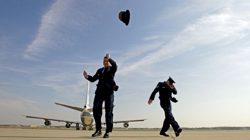 Air Force One knocks the hat off Air Force Col. Christopher M. Thompson as it leaves Andrews Air Force Base in Maryland on Thursday, October 20.
