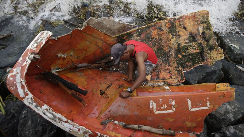 Joybin Marayo salvages metal from a damaged boat that was washed ashore by <a href="http://www.cnn.com/2016/10/18/asia/typhoons-haima-philippines/" target="_blank">Typhoon Haima</a> in Manila, Philippines. Haima, the second typhoon to hit the Philippines in less than a week, made landfall on Wednesday, October 19.
