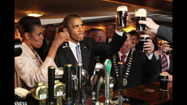 Obama and the first lady enjoy a glass of Guinness as they <a href="index.php?page=&url=http%3A%2F%2Fwww.cnn.com%2F2011%2FPOLITICS%2F05%2F23%2Fobama.ireland%2F" target="_blank">visit his ancestral home</a> of Moneygall, Ireland, on May 23, 2011. Moneygall is believed to be the birthplace of one of his great-great-great grandfathers.
